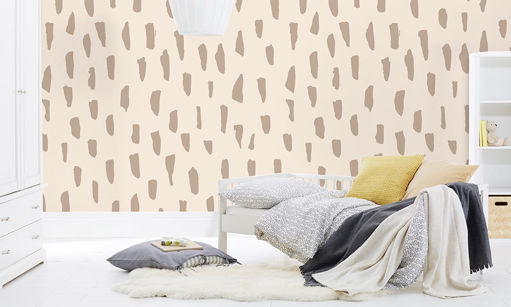 Large scale smudge wallpaper in neutral colour in a kids bedroom