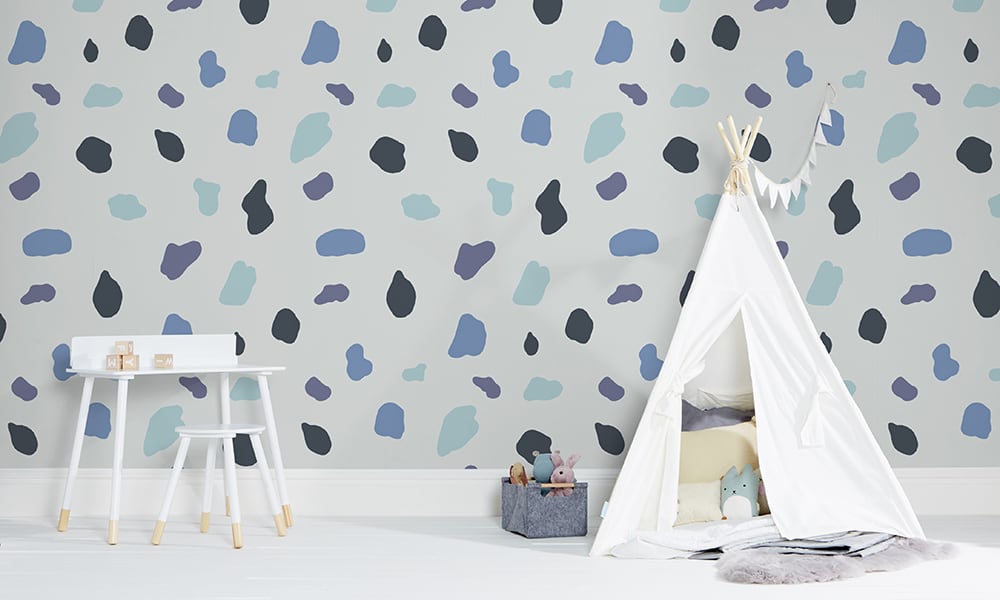 Large scale splodge wallpaper pattern with kids play tent