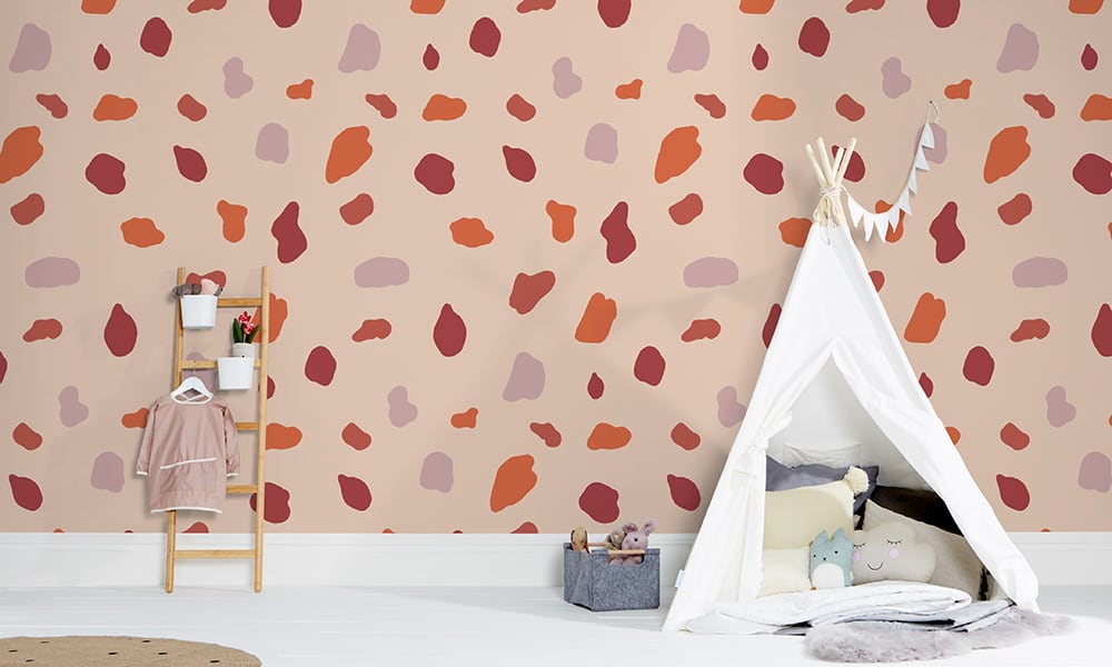 Large scale red splodge wallpaper pattern with kids play ladder