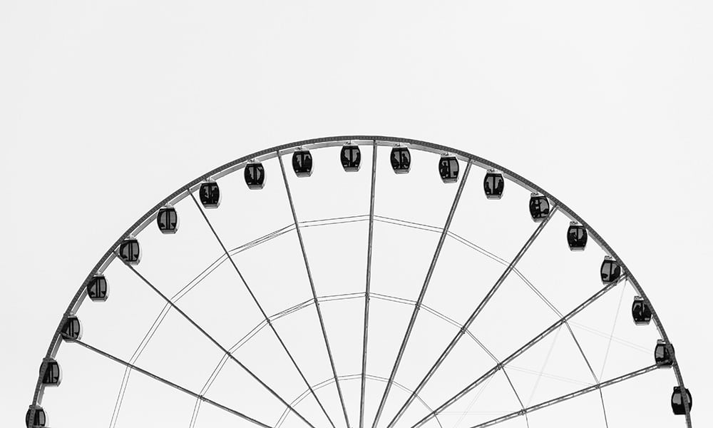 Black and white image of a ferris wheel