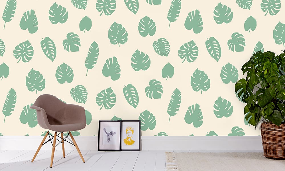Large scale wallpaper green leaves with grey chair