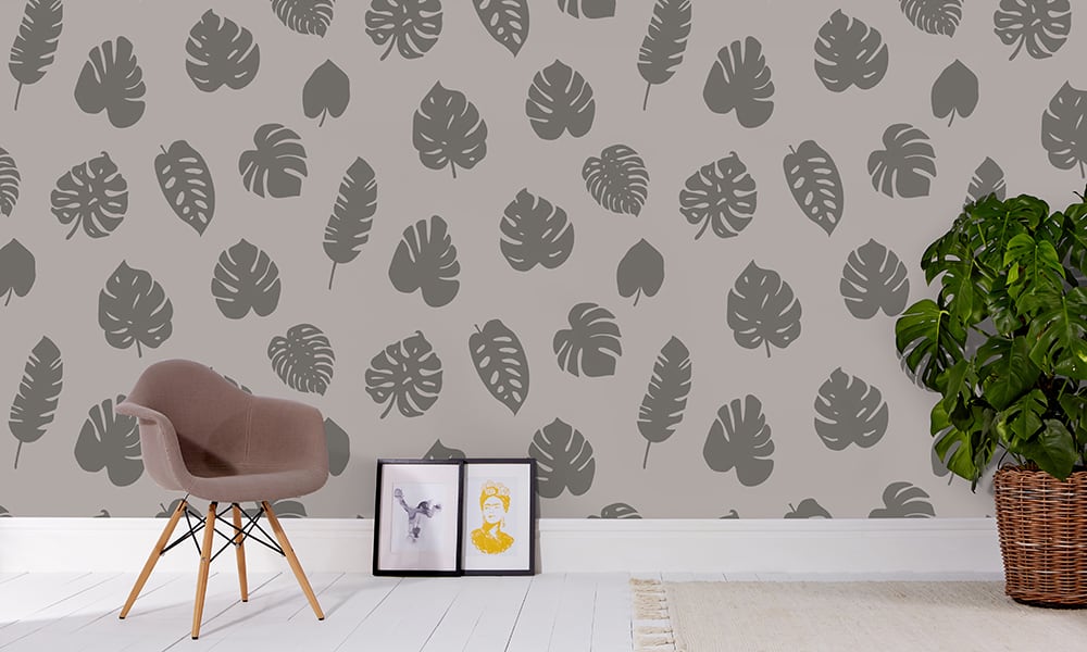 Large scale wallpaper grey leaves with grey chair and frame