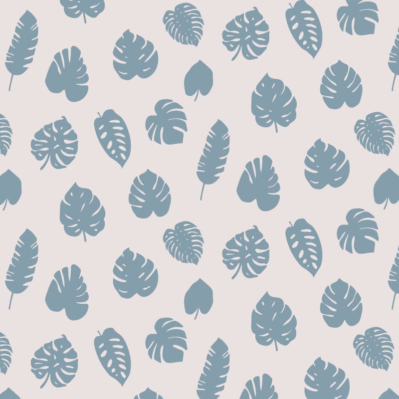 Blue leafy pattern on grey background wallpaper in living room with grey chair