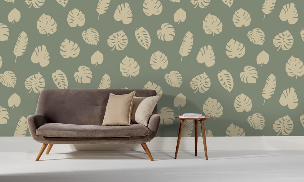 Large scale wallpaper green leaves with sofa and side table