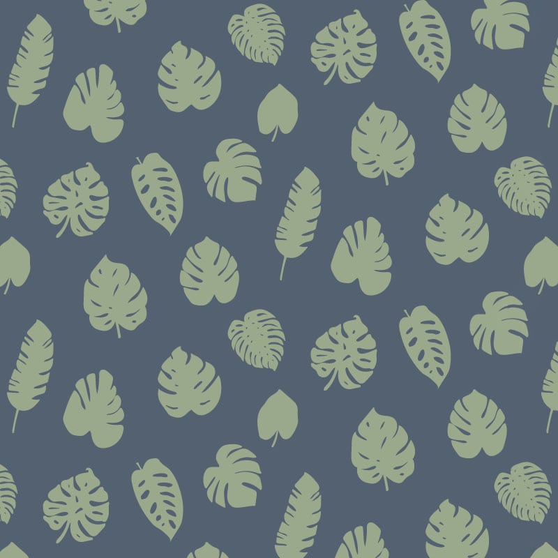 Green leafy pattern on blue background wallpaper in living room with grey sofa