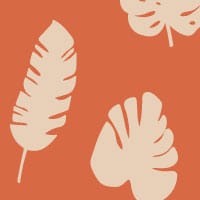 Orange leafy patterned wallpaper in living room with grey sofa and cheese plant