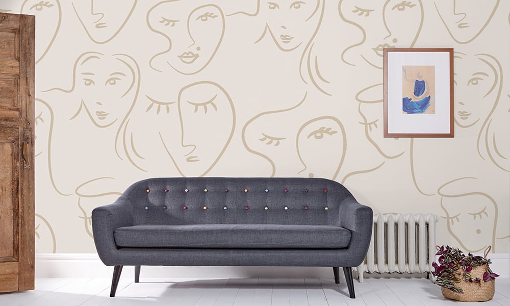 Female faces wallpaper in a neutral colour 