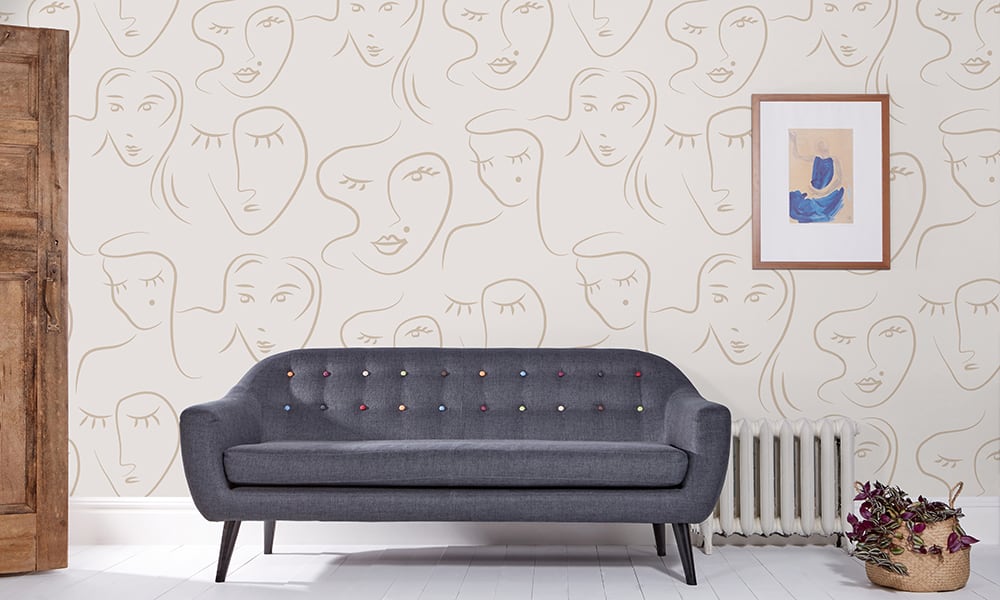Designer living room wallpaper made up of faces in a medium size