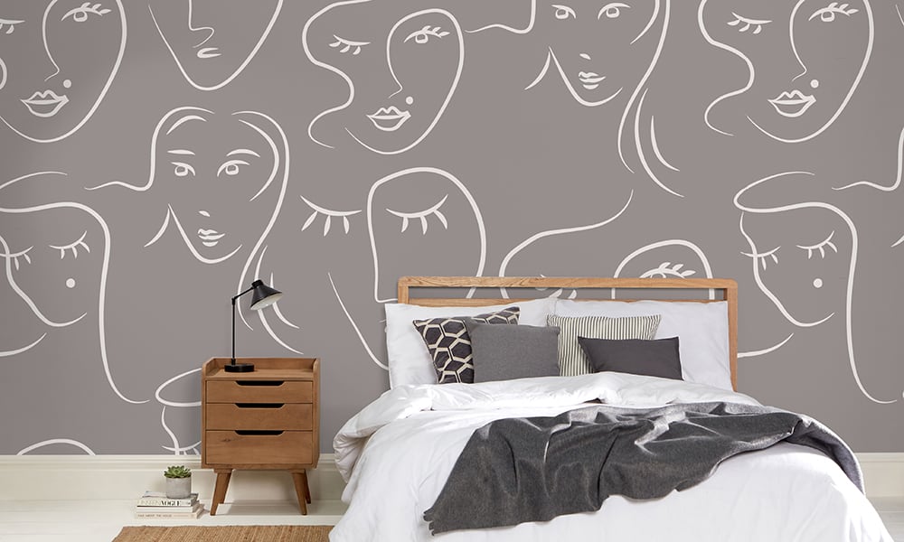White female faces pattern on grey wallpaper in bedroom - large scale