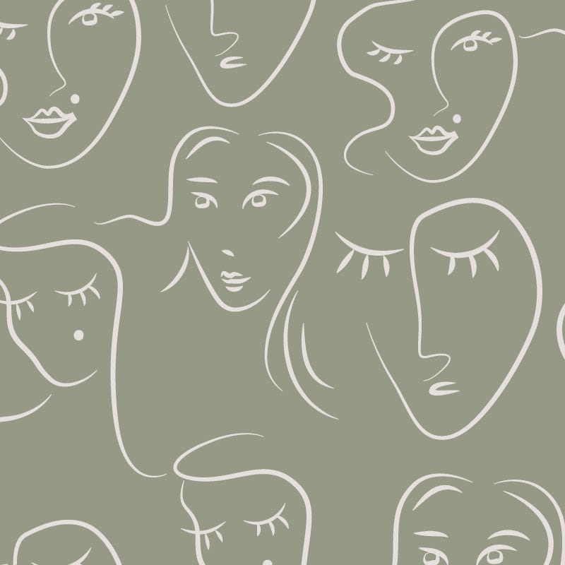 White faces pattern on green background wallpaper situated in bedroom setting