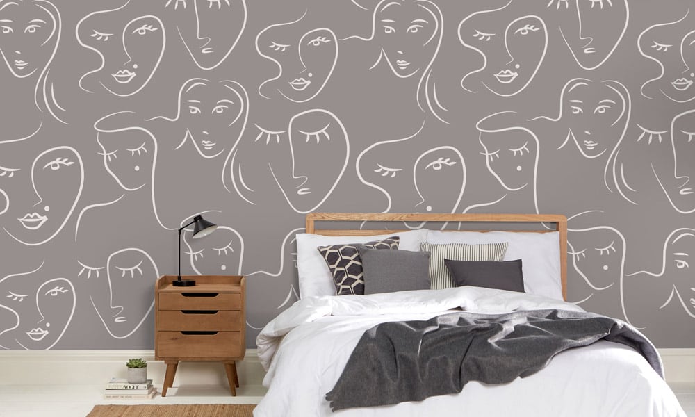 White female faces pattern on grey wallpaper in bedroom - medium scale