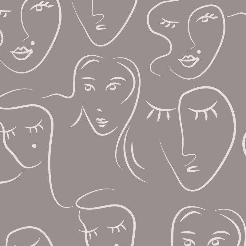 White faces pattern on grey background wallpaper situated in bedroom setting