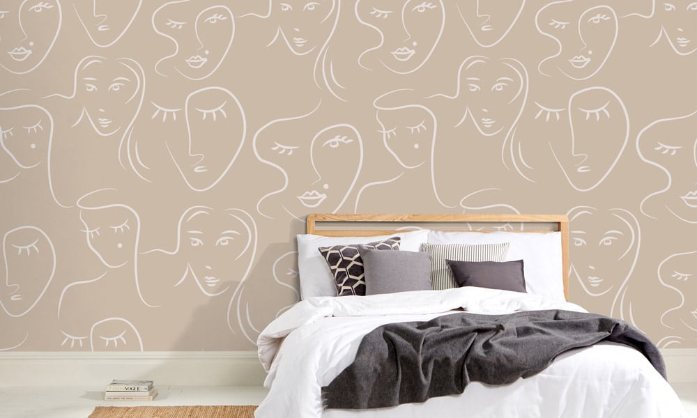 White female faces pattern on neutral wallpaper in bedroom - medium scale