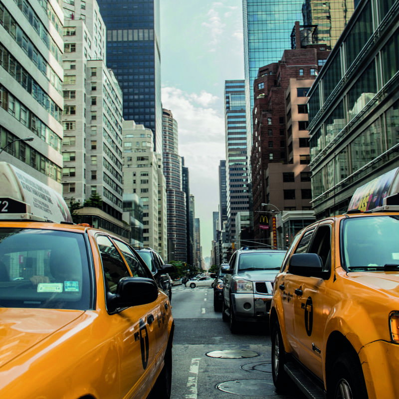 Yellow taxi new york wall mural in a living room